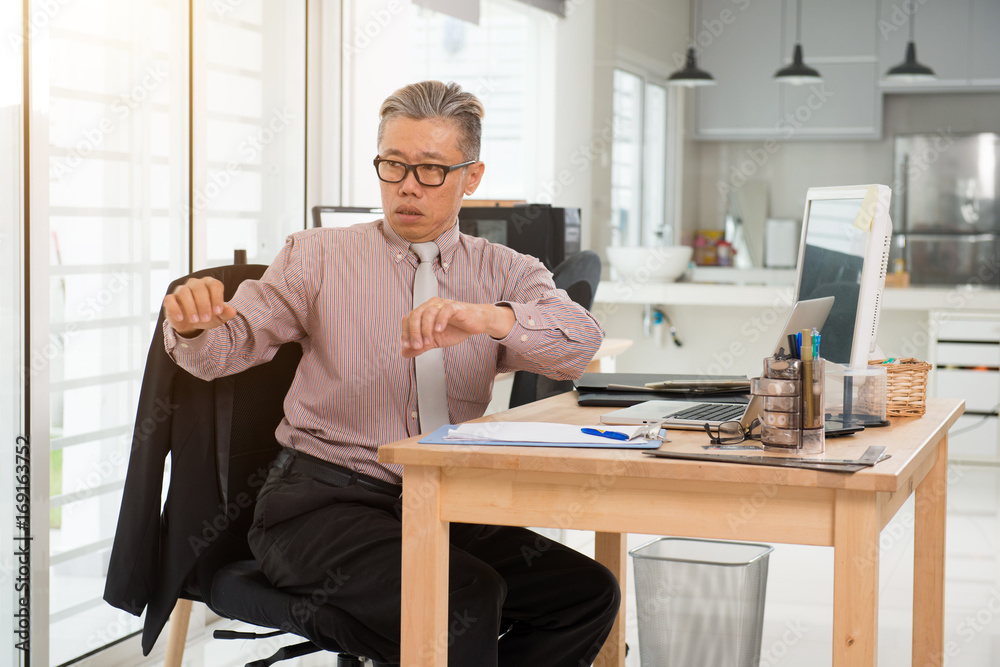 asian senior business man injury at work asian senior business man injury at work