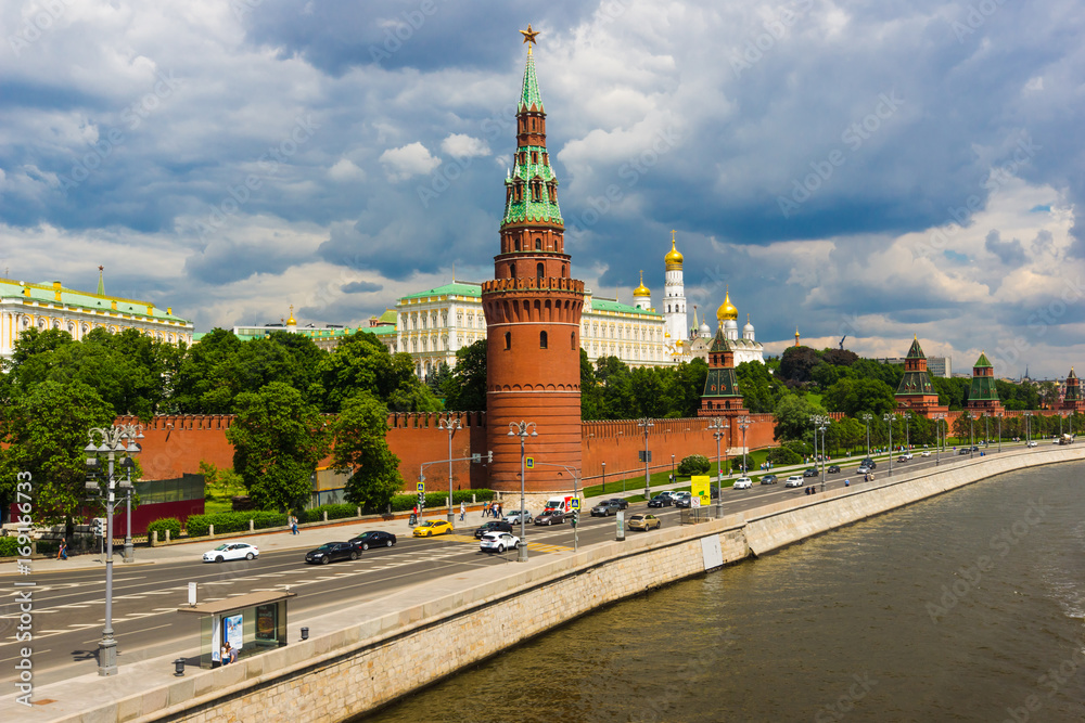 Kremlin and the Kremlin embankment in summer against the background of the cloudy sky. Thunderclouds