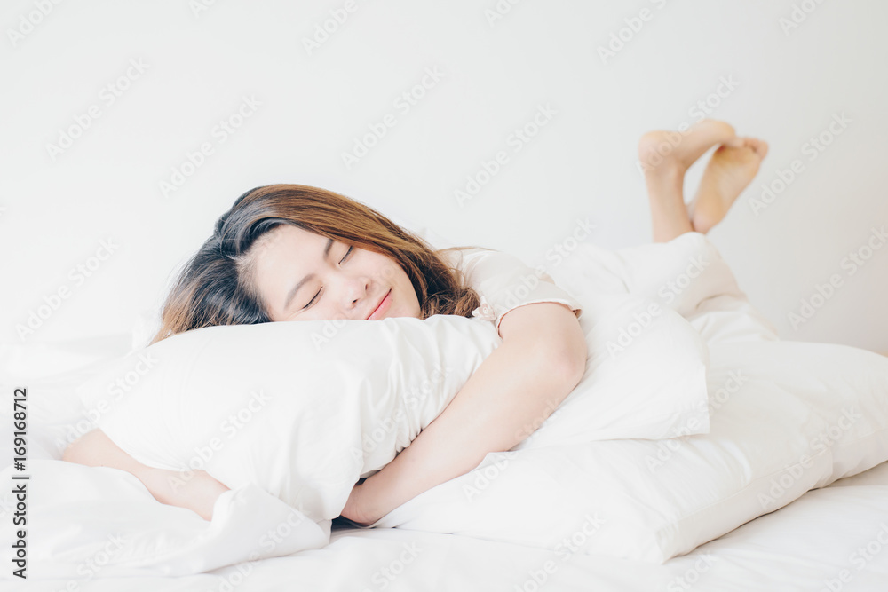 Portrait of asian women feelings relax and happy on her bed in the vacations time. Portrait of asian women feelings relax and happy on her bed in the vacations time.