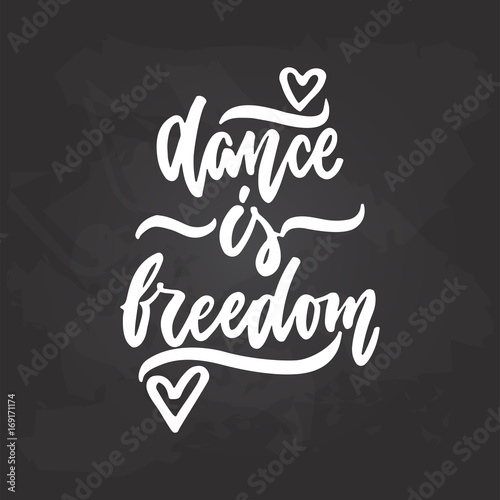 Dance is freedom - lettering dancing calligraphy quote drawn by ink in white color on the black chalkboard background. Fun hand drawn lettering inscription.