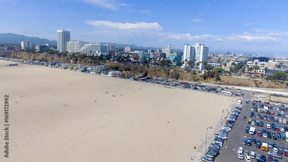 SANTA MONICA, CA - AUGUST 2ND, 2017: Santa Monica skyline and beach parking from high viewpoint. This is a major attraction in Los Angeles area
