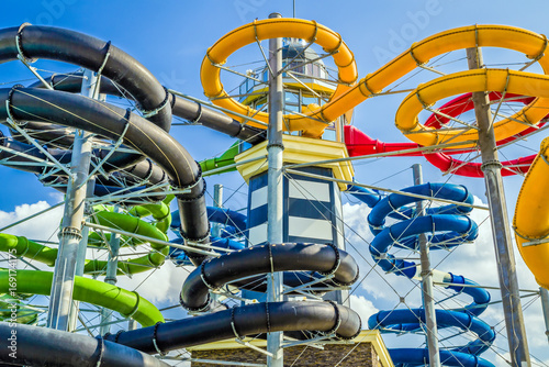 Colorful water slides in aquapark photo