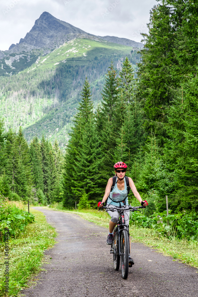 Woman on MTB bike in High Tatras mountains, Slovakia