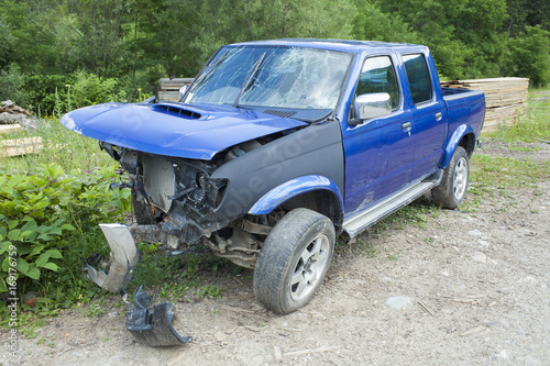 blue wrecked car after accident