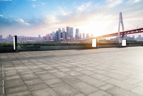 Panoramic skyline and buildings with empty concrete square floor