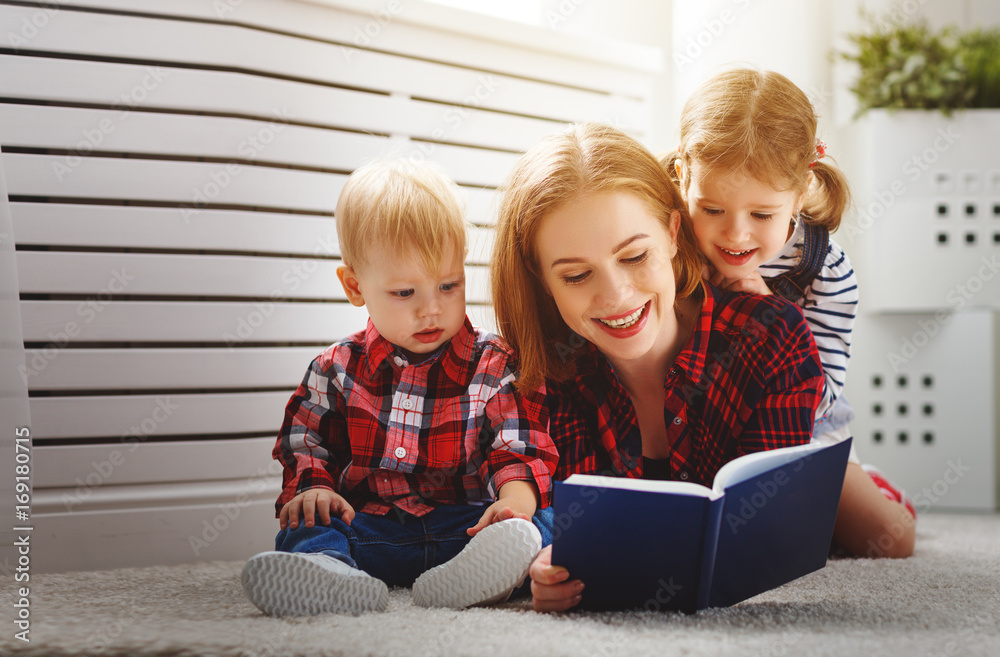 Mother reads book to children Mother reads book to children