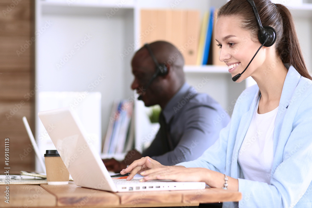 Portrait of an African American young business man with headset. Portrait of an African American young business man with headset.