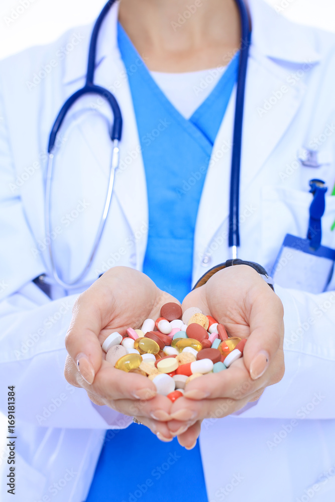 Doctor holding heap of drugs in a hand. Woman doctor Doctor holding heap of drugs in a hand. Woman doctor