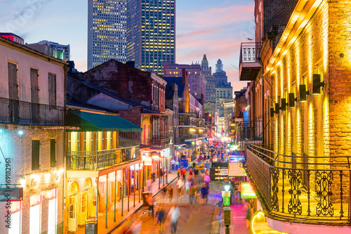 Платно Pubs and bars with neon lights in the French Quarter, New Orleans
