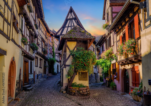Colorful half-timbered houses in Eguisheim, Alsace, France photo