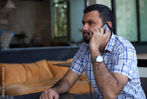 Handsome man using phone
