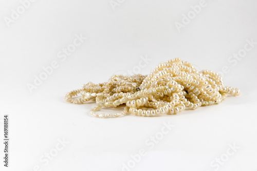 A bunch white pearls on white background