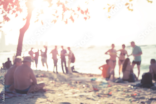 People sit on the beach in Pattaya, Thailand, and the picture is unclear and blurry
