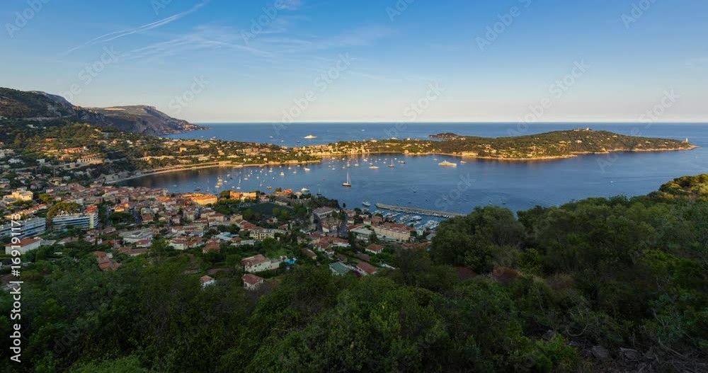 Villefranche-sur-Mer, Saint-Jean-Cap-Ferrat and the Espalmador Bay with yachts and tourist boats in summer (unset to twilight time-lapse). Cote d'Azur, French Riviera, Alpes Maritimes, PACA, France Villefranche-sur-Mer, Saint-Jean-Cap-Ferrat and the Espalmador Bay with yachts and tourist boats in summer (unset to twilight time-lapse). Cote d'Azur, French Riviera, Alpes Maritimes, PACA, France