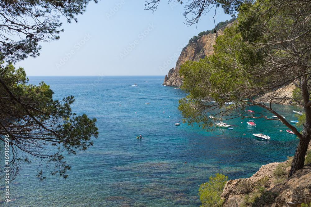 Coves of Cala Llorell beach in Tossa de Mar, Spain Coves of Cala Llorell beach in Tossa de Mar, Spain