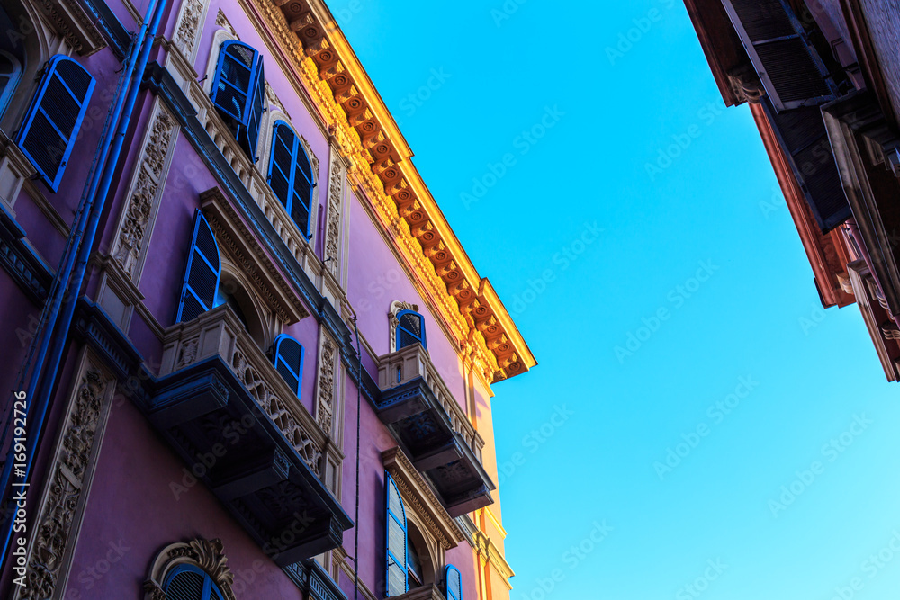 The facade of a building in the sunset The facade of a building in the sunset