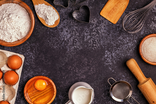 Ingredients for baking - flour, wooden spoon, rolling pin, eggs © tbralnina