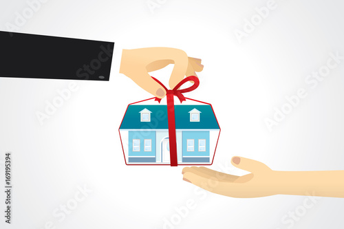 Hand giving a blue house tied with red ribbon to another hand.
