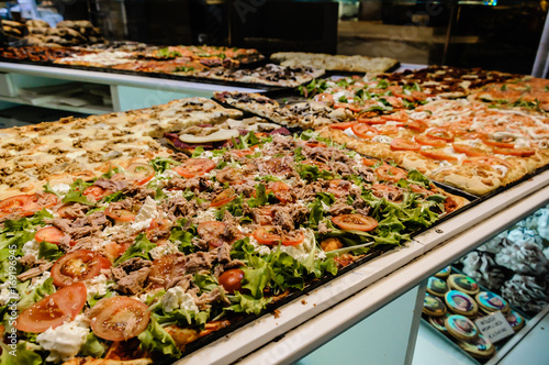 Pizza on sale at night in Citta Alta, Bergamo, Italy