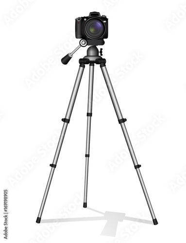 SLR camera on a tripod. Metal construction. Take a photo, movie or video.