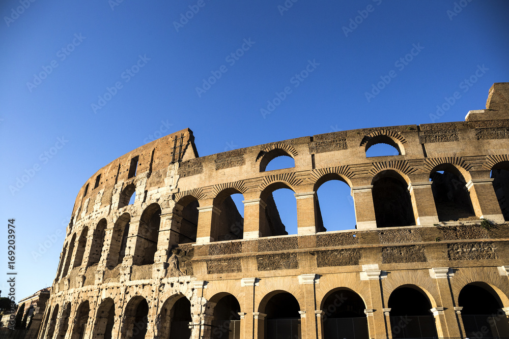 Part of the wall of Colosseum (Coliseum) in Rome, Italy at sunset