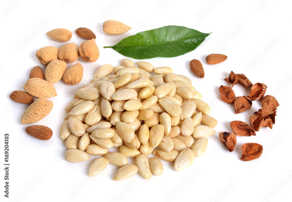 Blanched almonds with unshelled nuts. On white background. Blanched almonds with unshelled nuts. On white background.