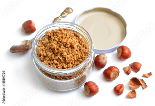 Homemade praline in the glass jar. With nuts. photo