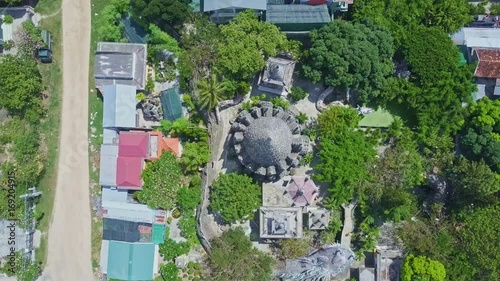 Drone Camera Rotates and Goes down above Buddhist Temple photo