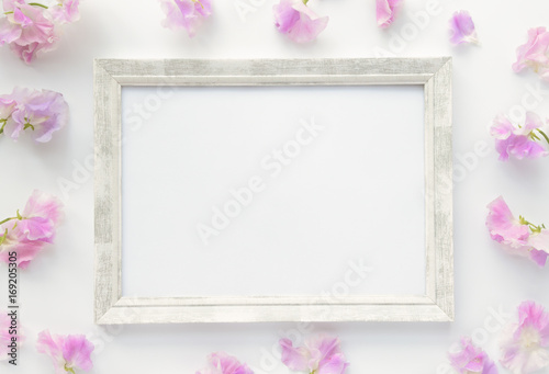 Wooden frame with pink flowers © FloweretteLV