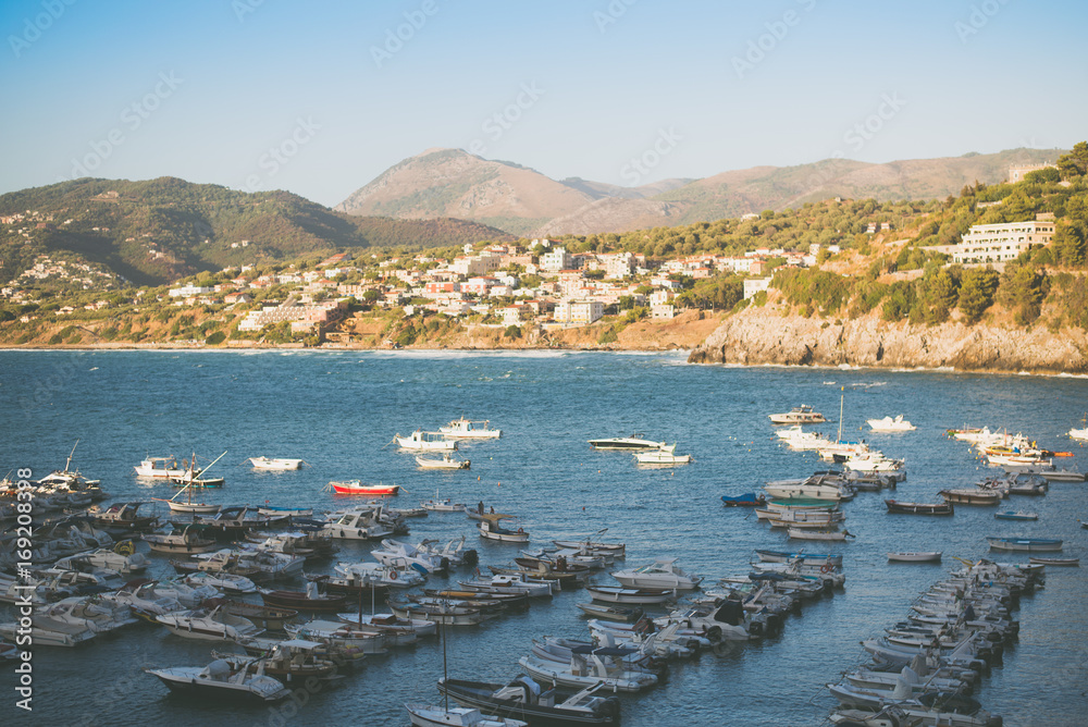 Harbour of Palinuro, Italy. Top view with boats and hills on the background.