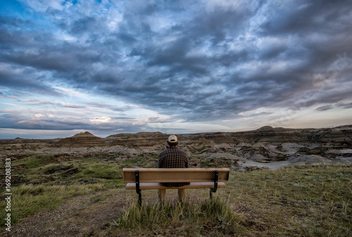 Man Sitting on Bench in the Alberta Badlands Dinosaur Provincial Park