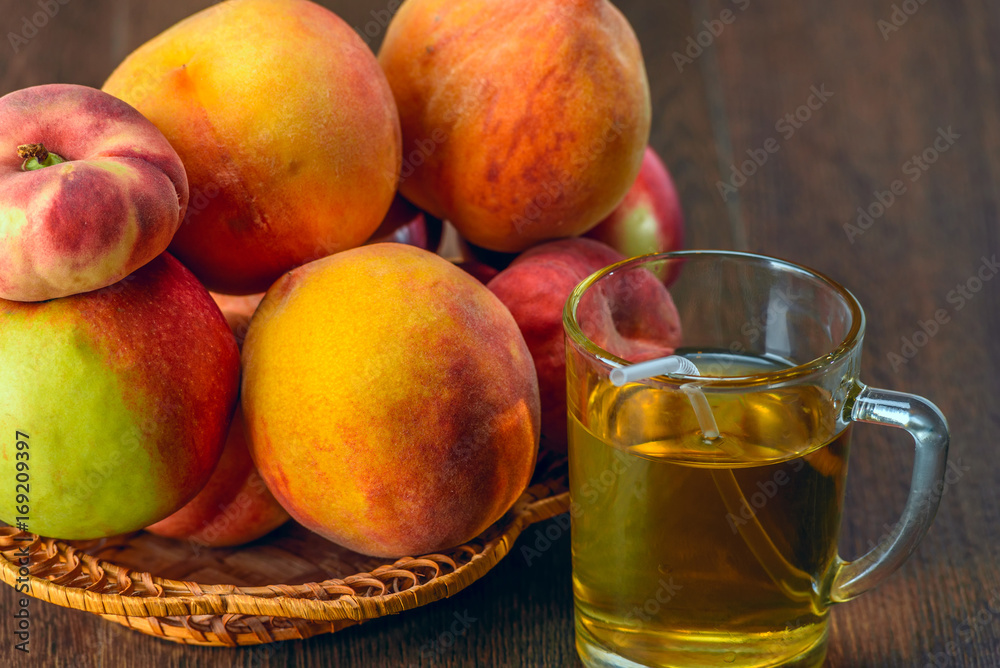 Still life of peaches and juice on a dark background Still life of peaches and juice on a dark background