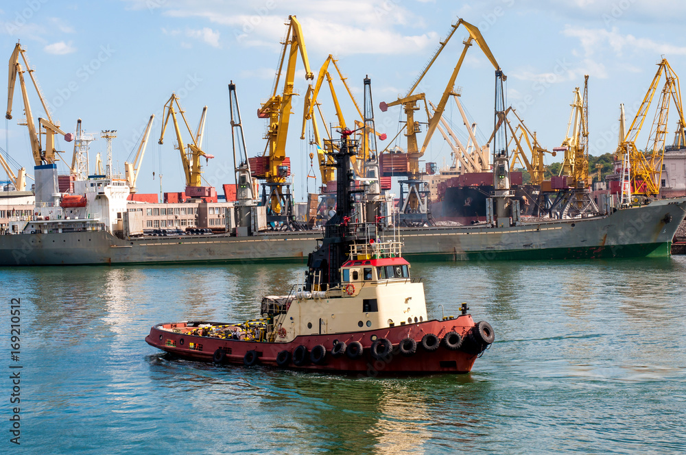 Cargo ship in the Black Sea in Odessa. Boat to dock for transportation. 24-08-2017