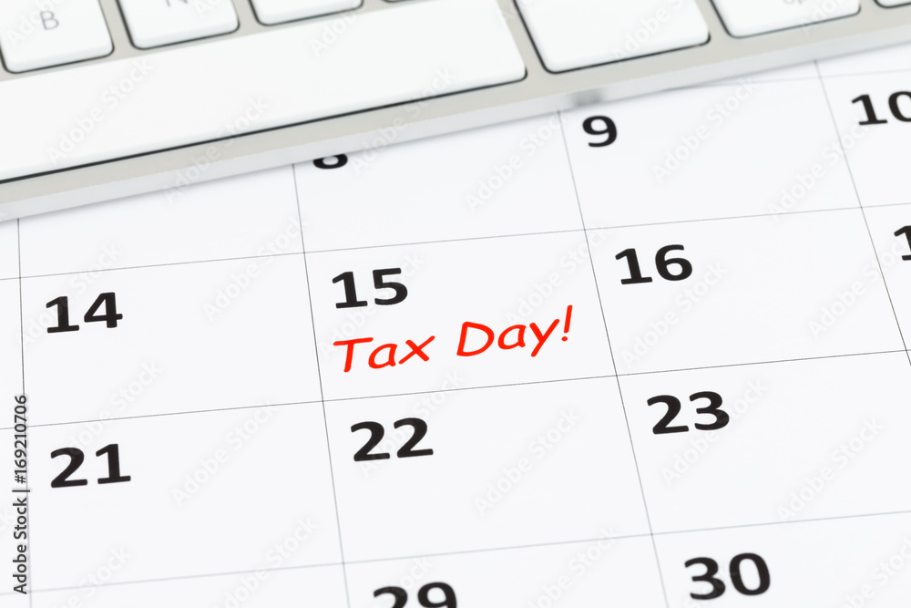 Tax day on calendar with keyboard Tax day on calendar with keyboard
