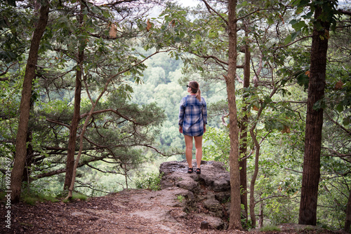 Person looking out over cliff