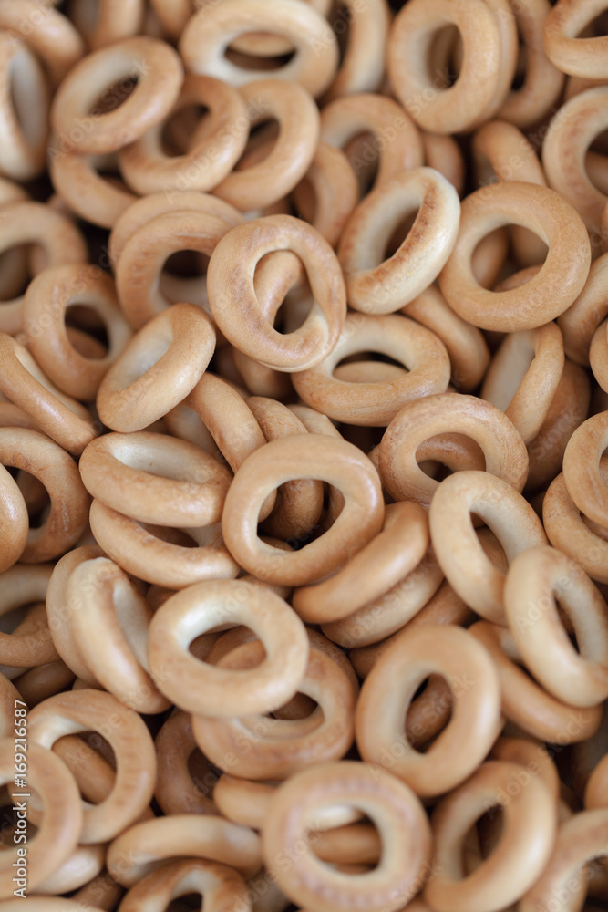 Lots of brown crispy bagels for the background. Traditional Russian pastries. Lots of brown crispy bagels for the background. Traditional Russian pastries.