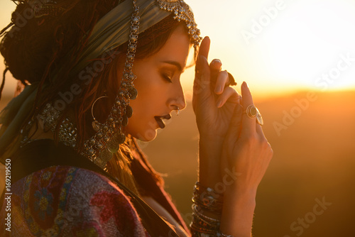 gypsy woman in a desert photo