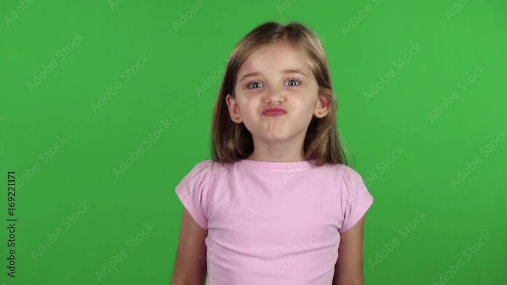 Child is angry, she is very nervous. Green screen. Slow motion Child is angry, she is very nervous. Green screen. Slow motion