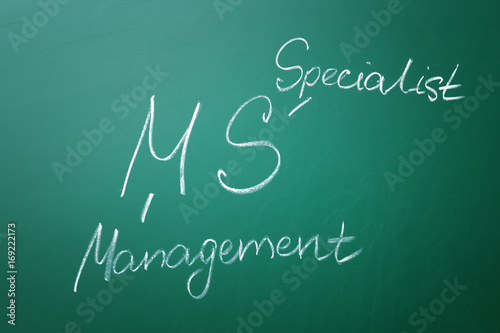 Management abbreviation MS with its full form written on chalk board photo