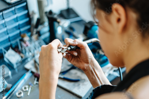 The girl is engaged in jewelry business