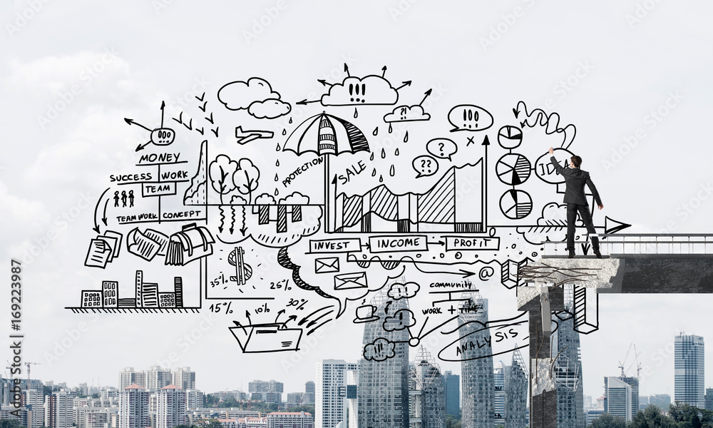 Fototapeta premium Businessman drawing business conceptual sketches.