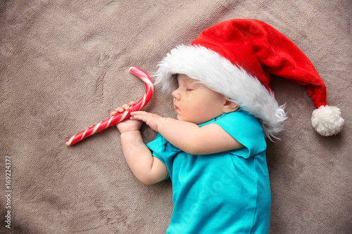 Cute little baby in Santa h...