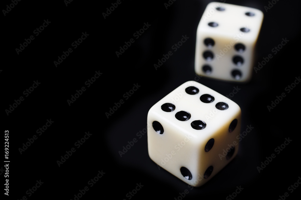 Dice on a black background - selective focus Dice on a black background - selective focus