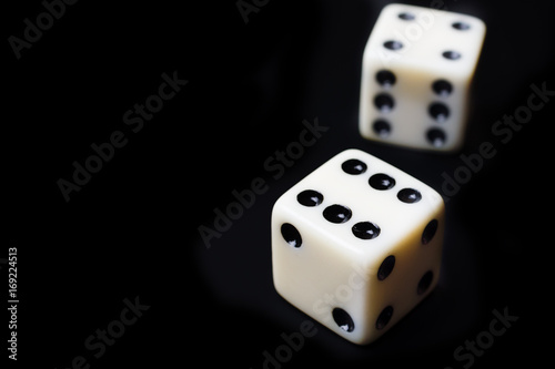 Dice on a black background - selective focus