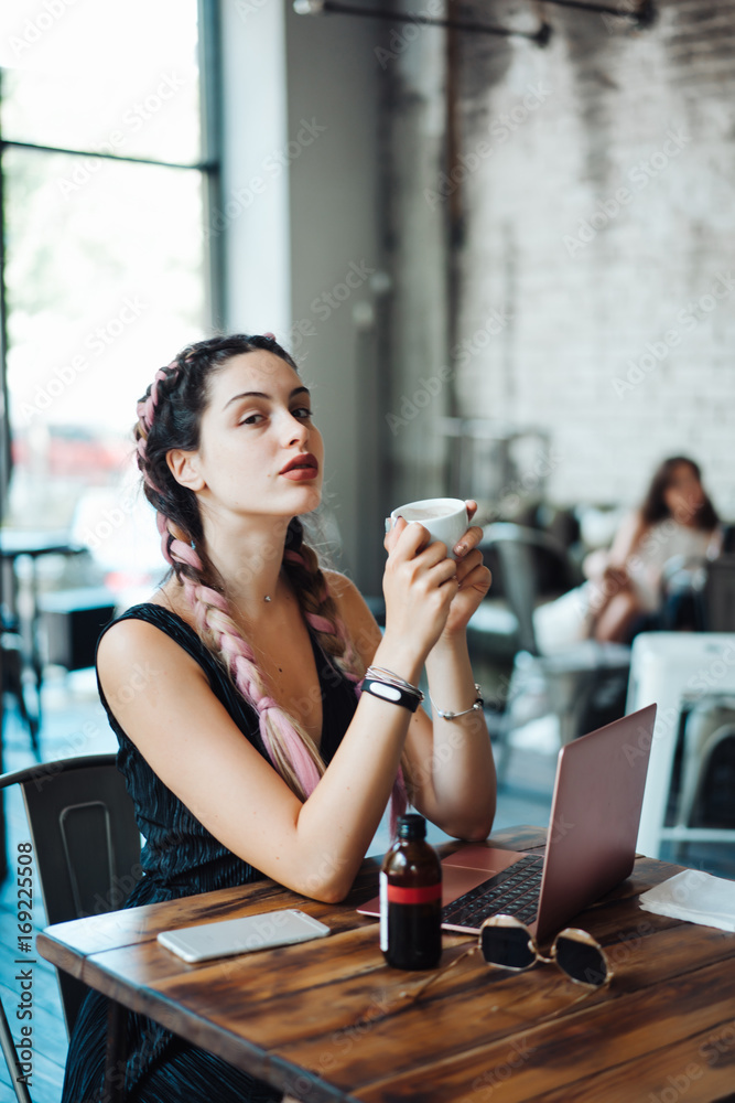 © teksomolika - Young woman sitting in coffee shop © teksomolika - Young woman sitting in coffee shop
