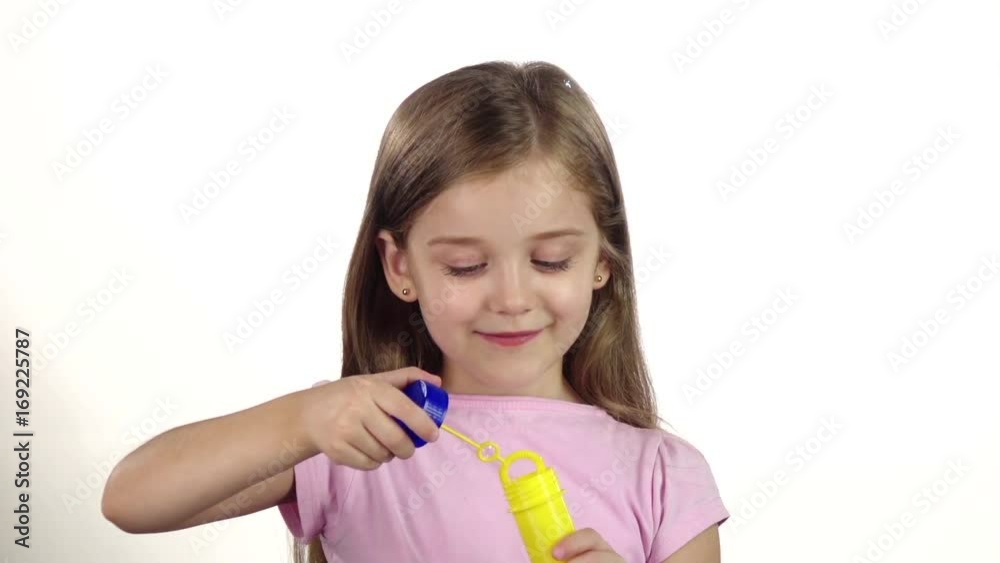 Child lets the soap bubbles. White background. Slow motion Child lets the soap bubbles. White background. Slow motion