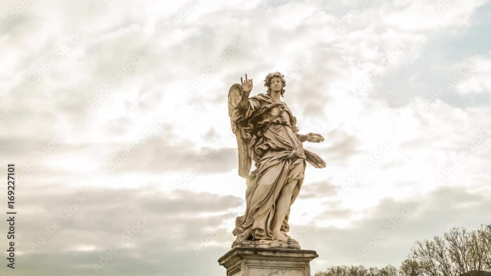 Motion timelapse of Angel sculpture at the Saint Angel's bridge near castle with beautiful sun shine. Rome, Italy. April, 2016. Motion timelapse of Angel sculpture at the Saint Angel's bridge near castle with beautiful sun shine. Rome, Italy. April, 2016.