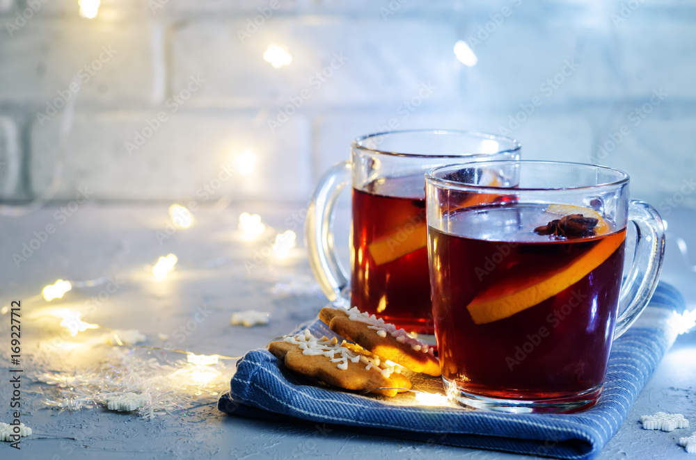 Mulled wine with gingerbread cookies and Christmas light Mulled wine with gingerbread cookies and Christmas light