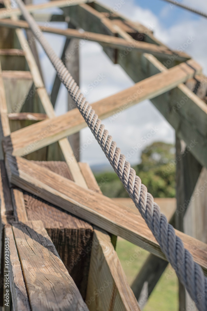 Close-up, isolated view of part of a wooden suspension bridge Close-up, isolated view of part of a wooden suspension bridge