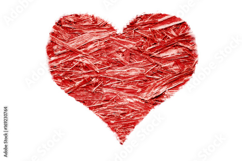 Heart shaped colorful bright red compressed recycled compressed wood chippings plywood isolated on a white background